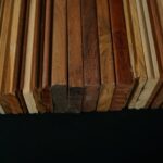a stack of wooden planks on a black background